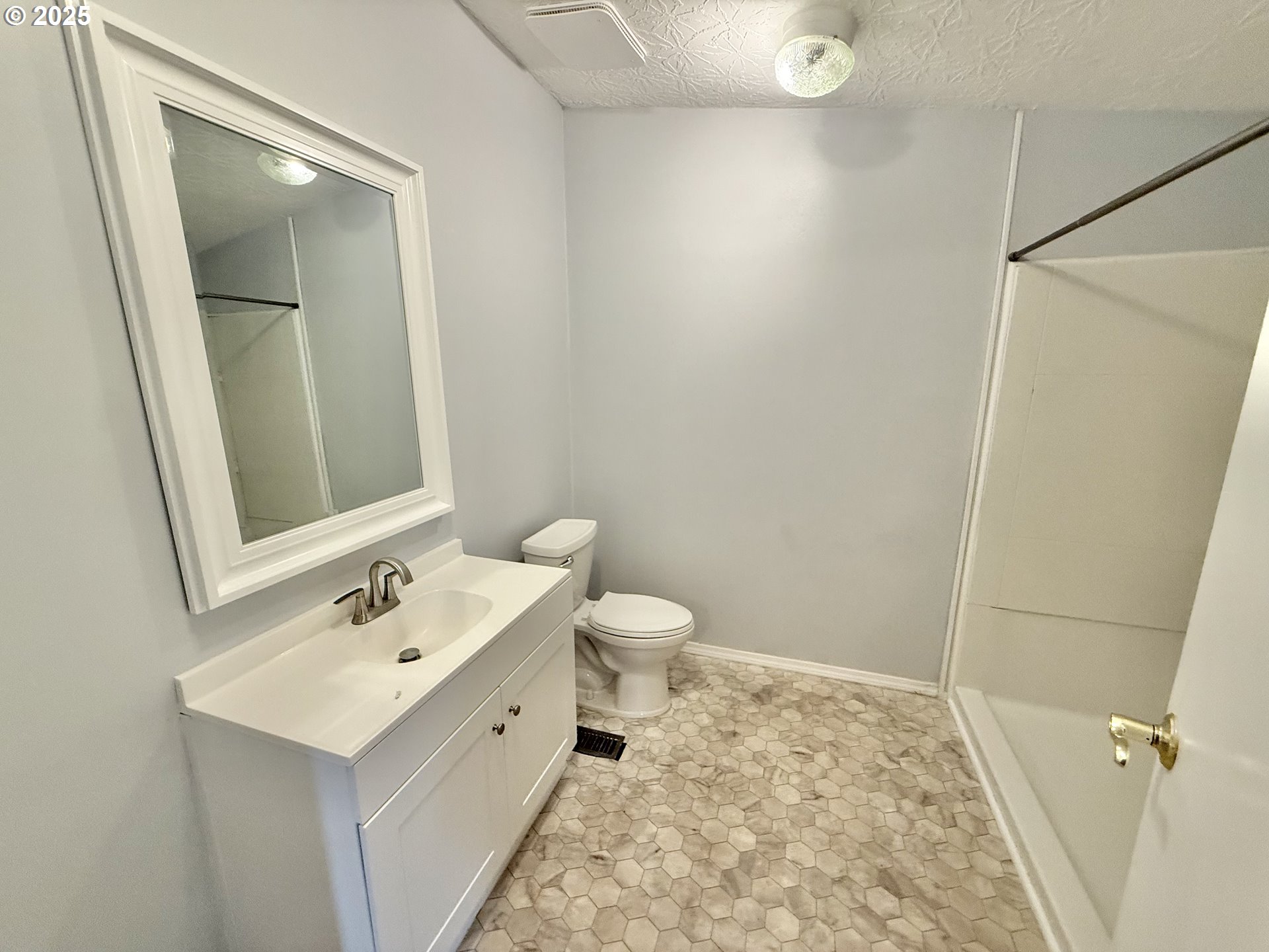 1282 3rd Street, Unit 37 Lafayette, OR 97127 - Photo 11 of 31 a bathroom with a sink a toilet and mirror