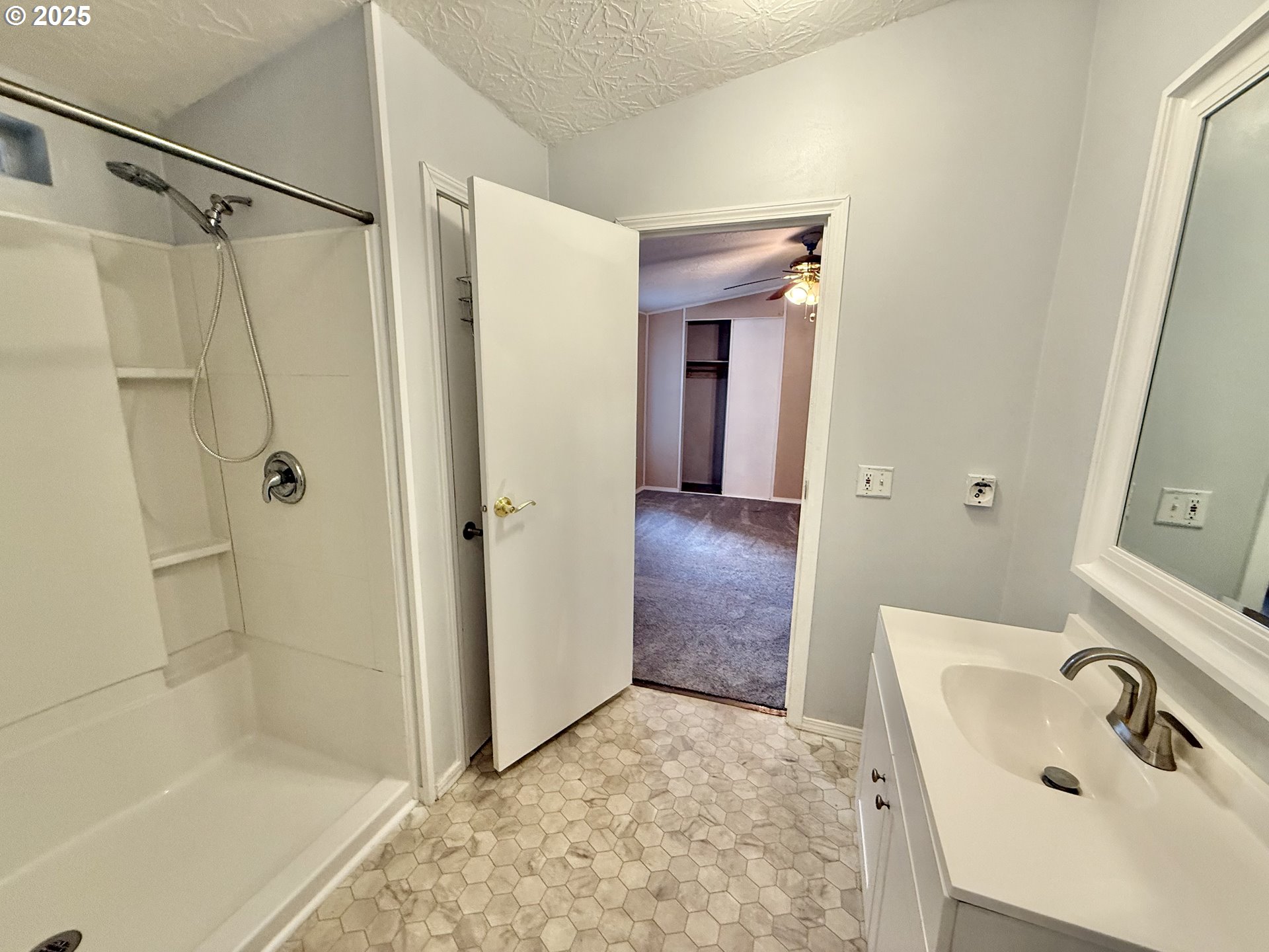 1282 3rd Street, Unit 37 Lafayette, OR 97127 - Photo 12 of 31 a bathroom with a sink and shower