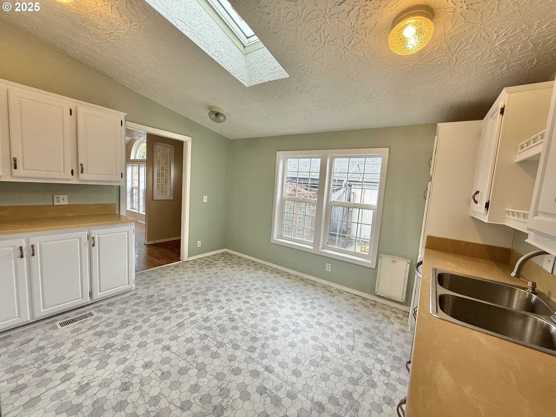 1282 3rd Street, Unit 37 Lafayette, OR 97127 - Photo 14 of 31 a view of a kitchen with a sink dishwasher and a refrigerator