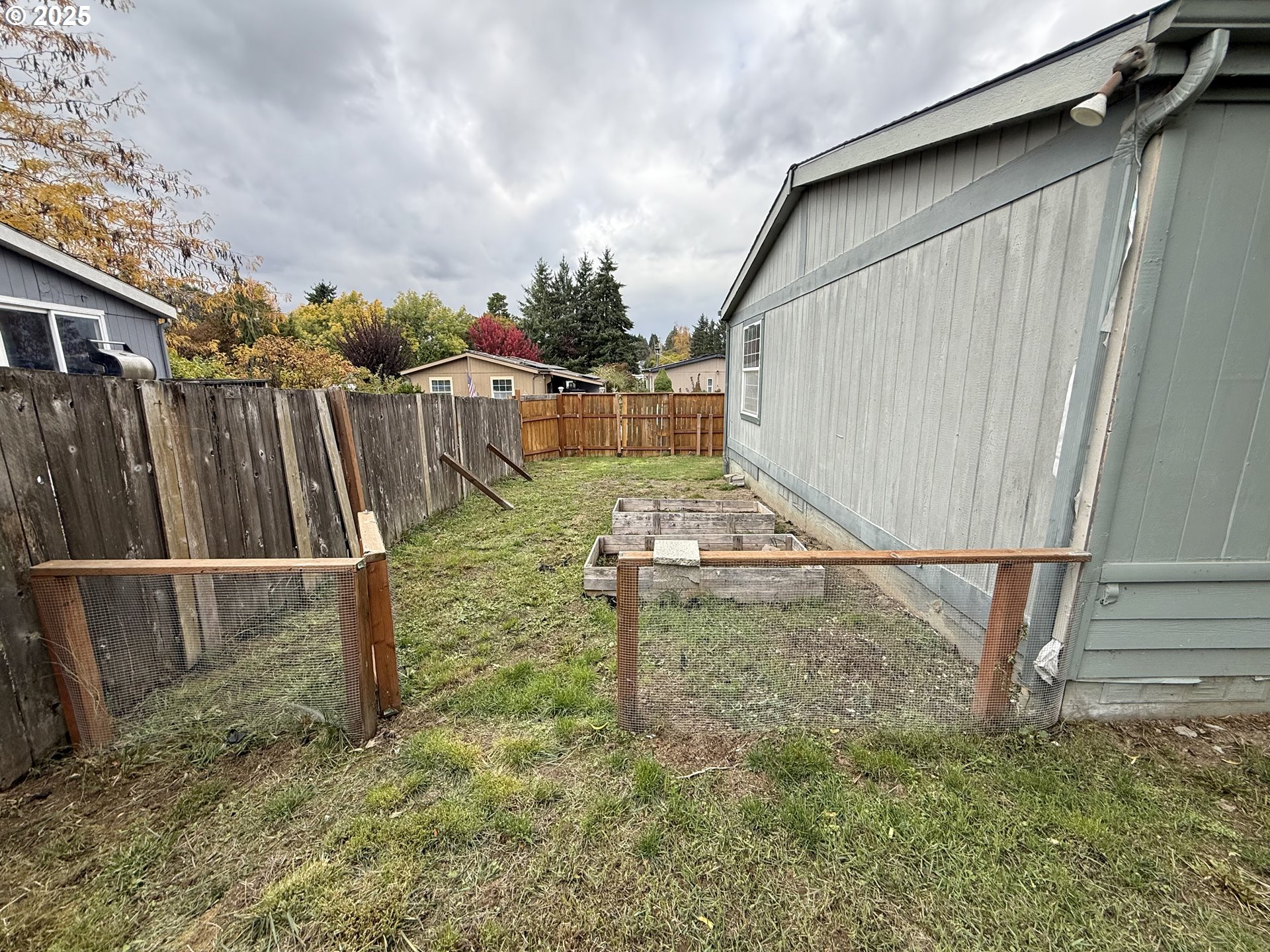 1282 3rd Street, Unit 37 Lafayette, OR 97127 - Photo 16 of 31 a view of a backyard with wooden fence