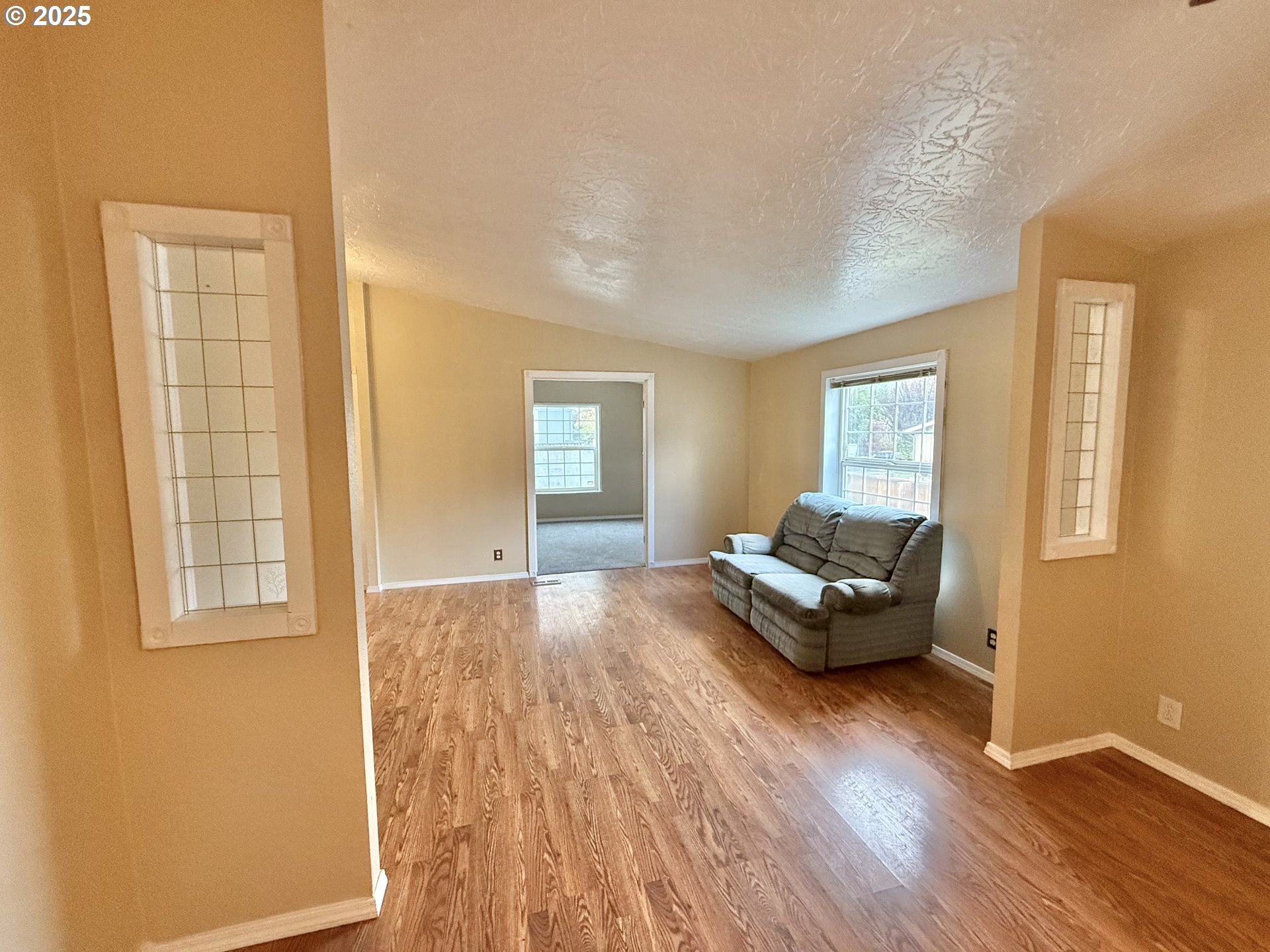 1282 3rd Street, Unit 37 Lafayette, OR 97127 - Photo 21 of 31 a living room with furniture and wooden floor