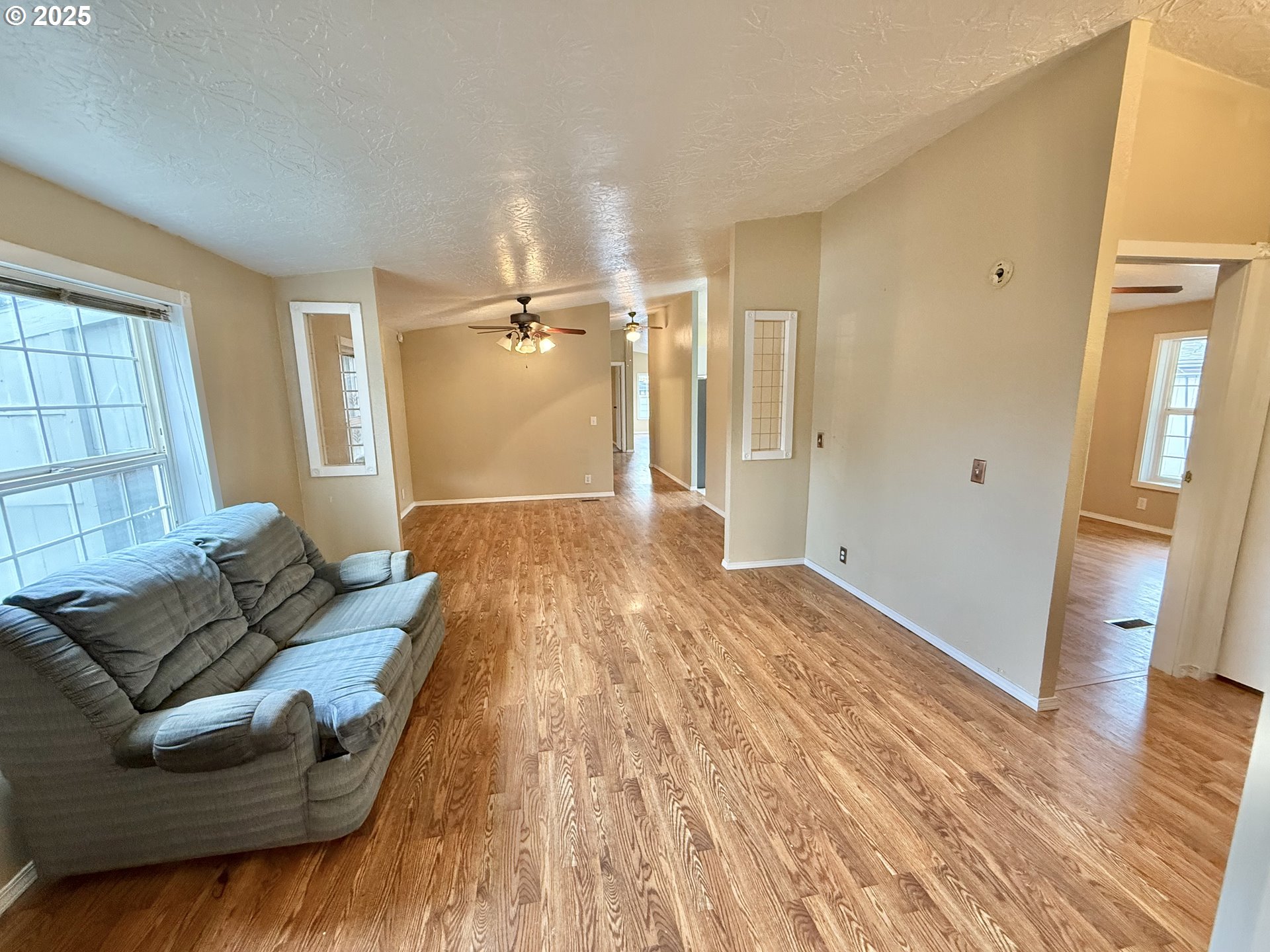 1282 3rd Street, Unit 37 Lafayette, OR 97127 - Photo 24 of 31 a living room with furniture and a wooden floor