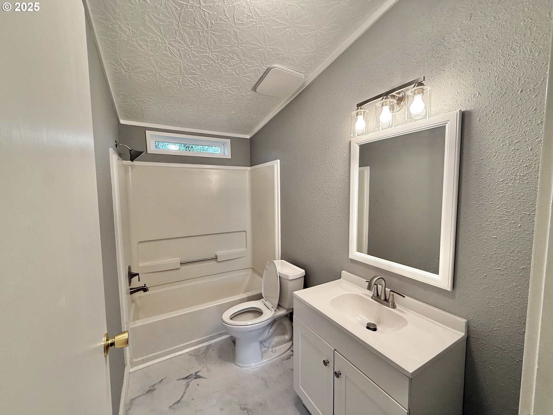 1282 3rd Street, Unit 37 Lafayette, OR 97127 - Photo 27 of 31 a bathroom with a toilet sink vanity and mirror