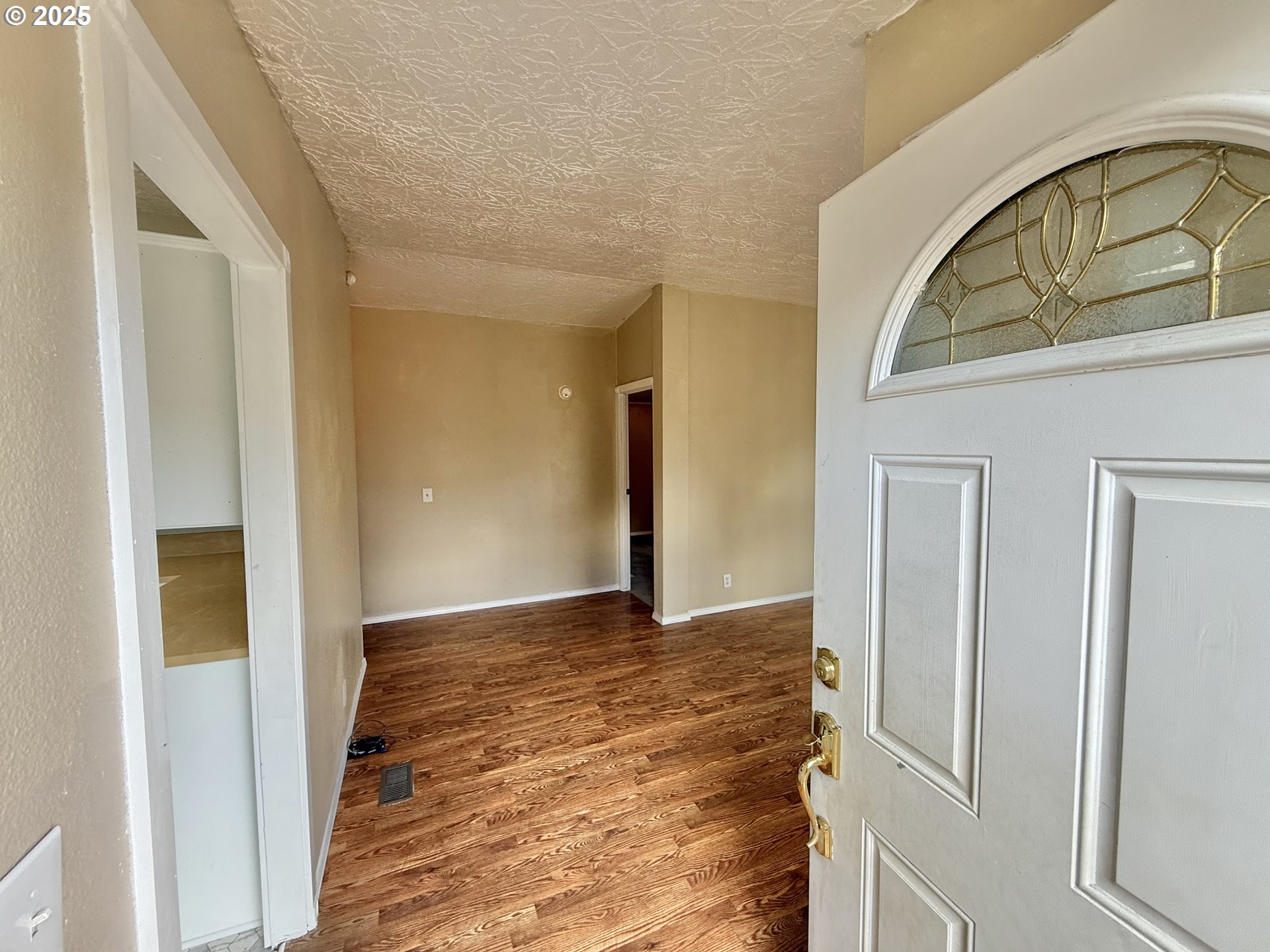 1282 3rd Street, Unit 37 Lafayette, OR 97127 - Photo 3 of 31 a view of an entryway with wooden floor