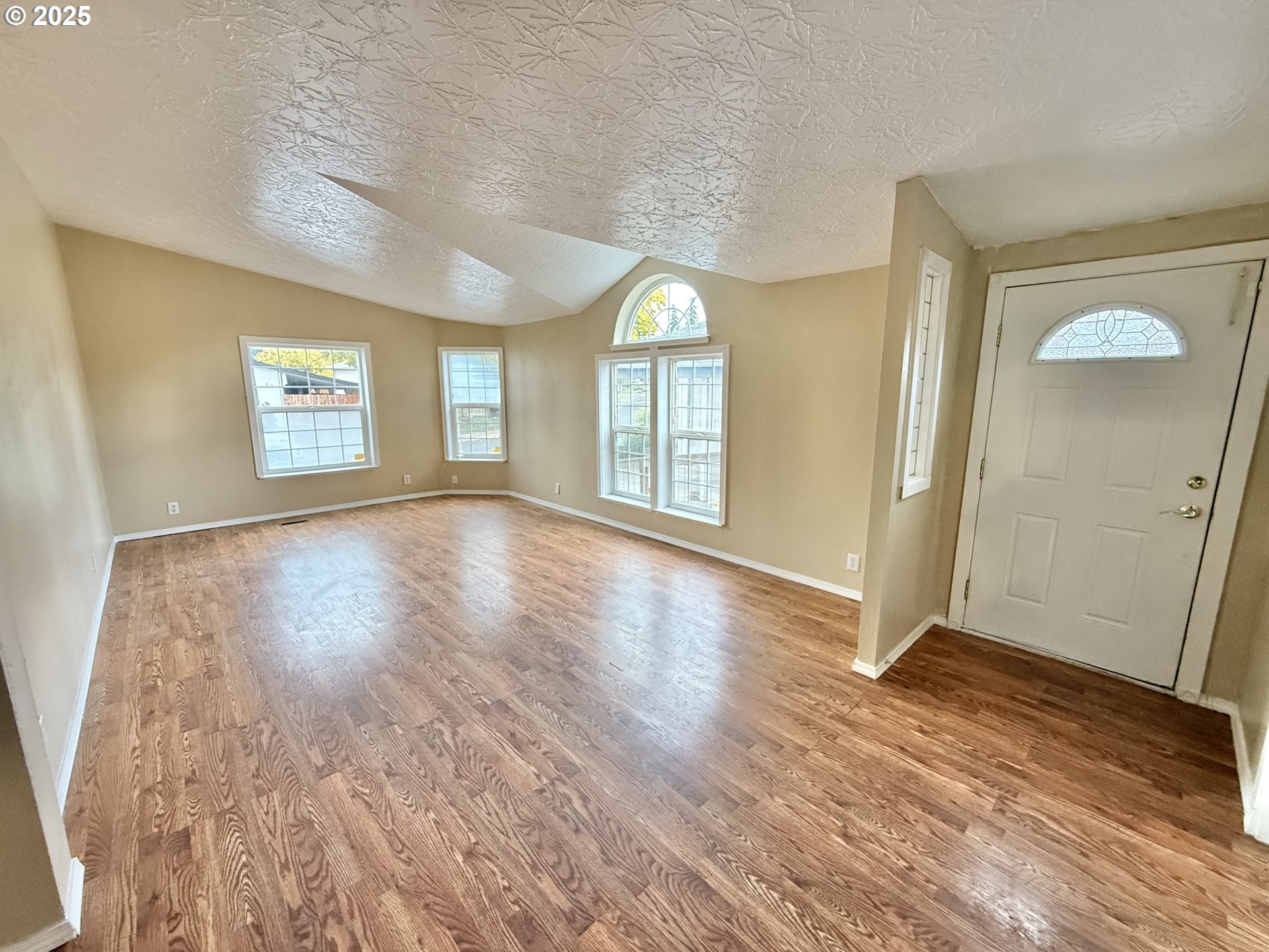 1282 3rd Street, Unit 37 Lafayette, OR 97127 - Photo 4 of 31 wooden floor in an empty room with a window