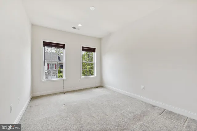 a kitchen with stainless steel appliances granite countertop a sink a stove and a wooden floors