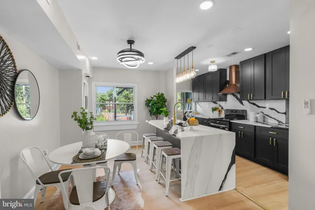 a view of kitchen with sink and living room