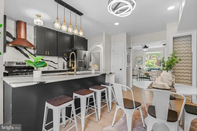 a kitchen with a table and chairs in it