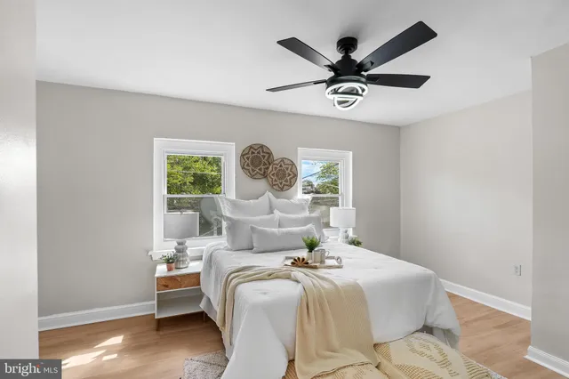 a bedroom with a large bed and a window