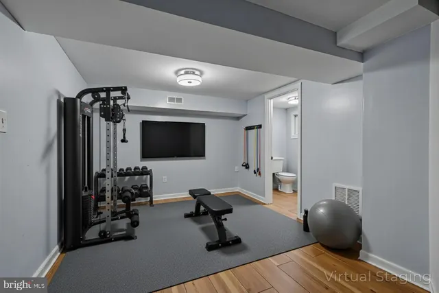 a view of a livingroom with entryway and a couch