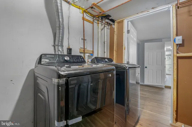 a view of a house with a wooden deck