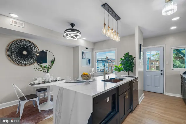 a kitchen with a dining table and chairs