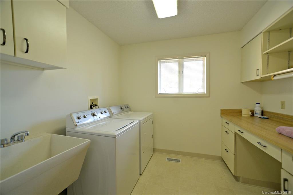 724 Laurel Ridge Road, Unit 23&24 Columbus, NC 28722 - Photo 13 of 25 a utility room with a sink dryer and washer