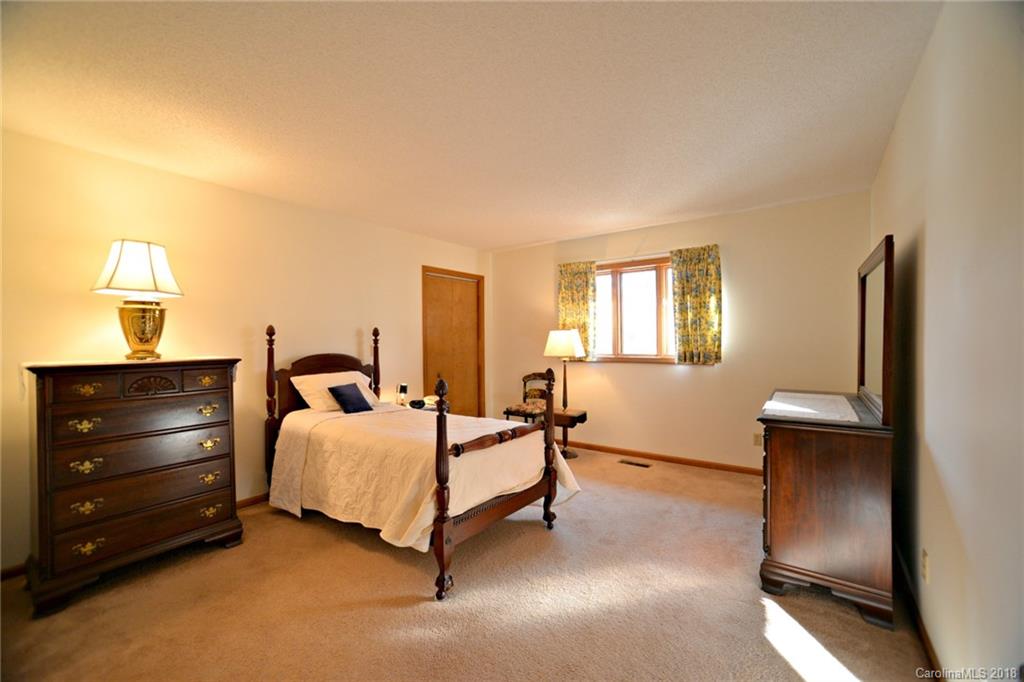 724 Laurel Ridge Road, Unit 23&24 Columbus, NC 28722 - Photo 14 of 25 a bedroom with a bed and a window