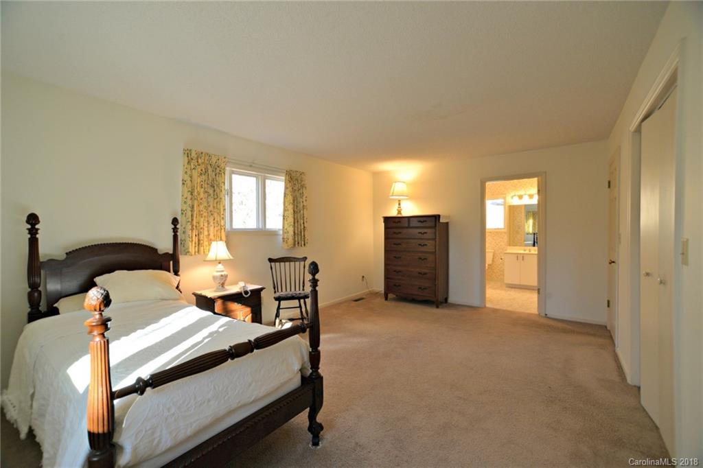 724 Laurel Ridge Road, Unit 23&24 Columbus, NC 28722 - Photo 16 of 25 a bedroom with furniture and window