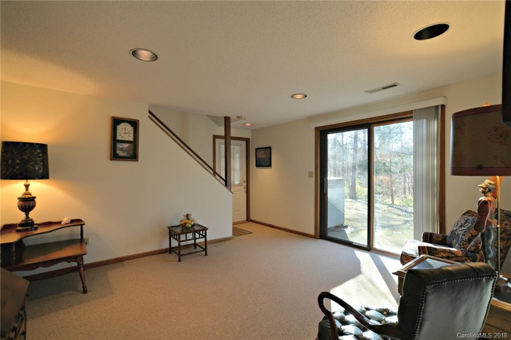 724 Laurel Ridge Road, Unit 23&24 Columbus, NC 28722 - Photo 19 of 25 a room with gym equipment and a flat screen tv