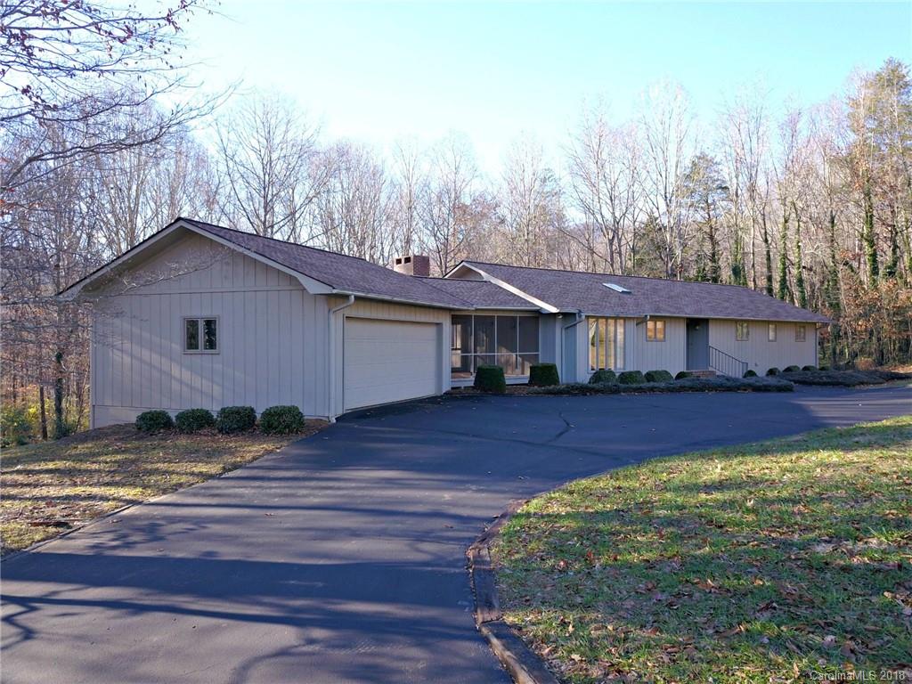 724 Laurel Ridge Road, Unit 23&24 Columbus, NC 28722 - Photo 3 of 25 a front view of a house with a yard