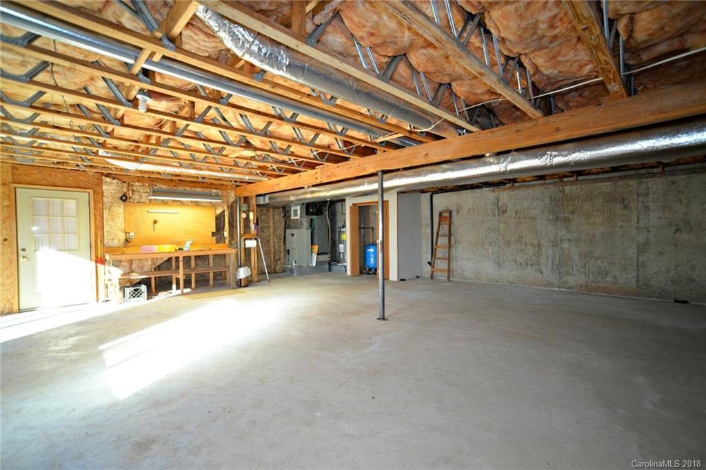 724 Laurel Ridge Road, Unit 23&24 Columbus, NC 28722 - Photo 23 of 25 a view of a room with gym equipment