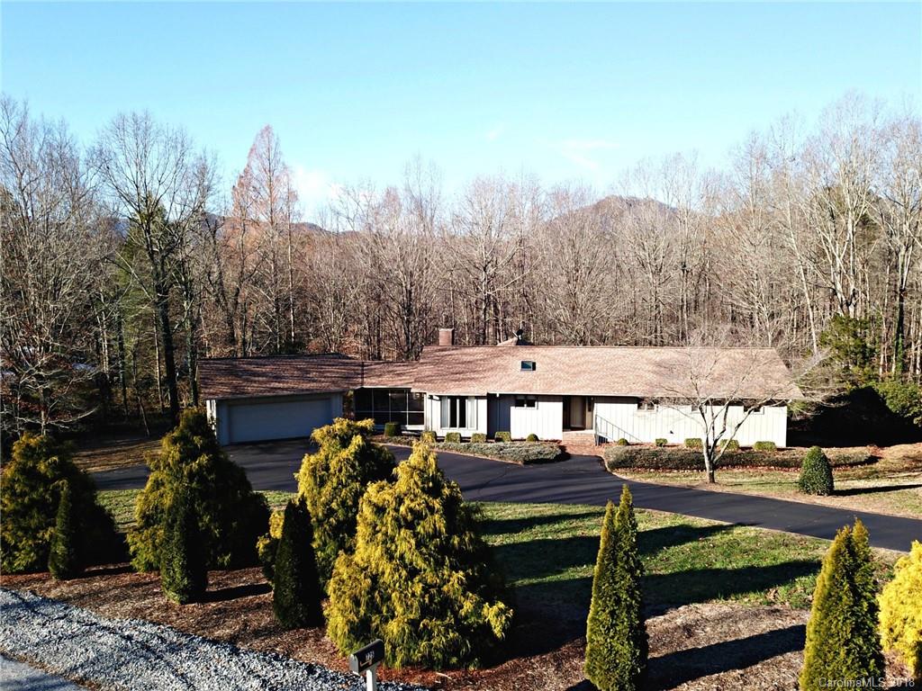 724 Laurel Ridge Road, Unit 23&24 Columbus, NC 28722 - Photo 4 of 25 a view of a house with backyard and sitting area