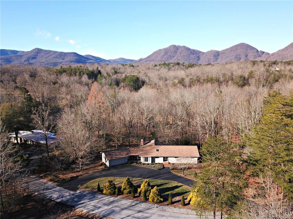 724 Laurel Ridge Road, Unit 23&24 Columbus, NC 28722 - Photo 5 of 25 a view of a lake with a mountain in the background