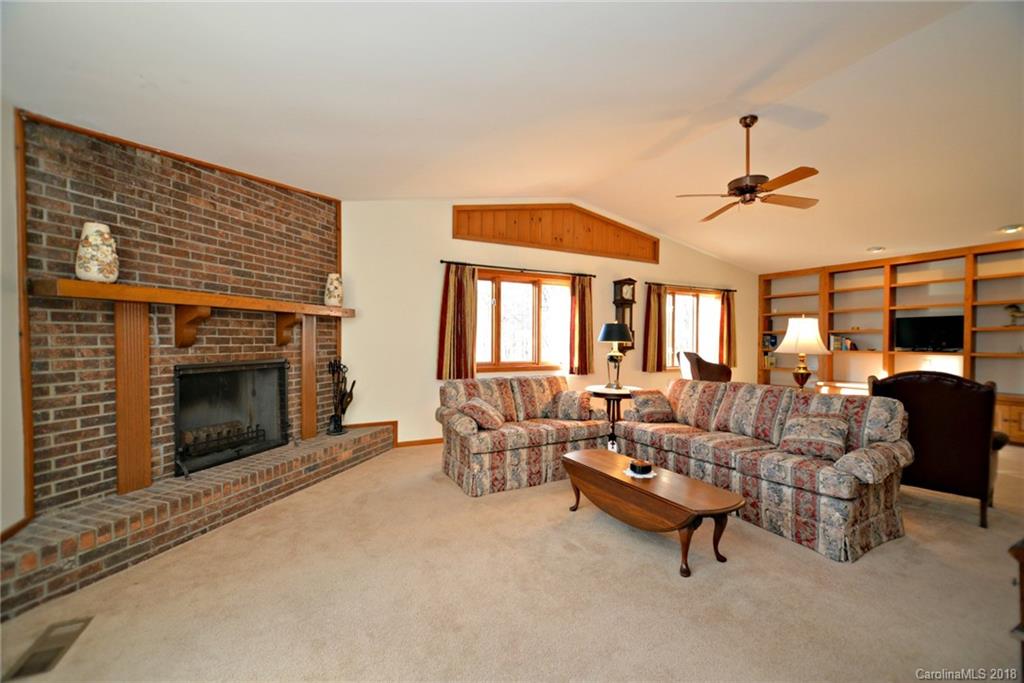 724 Laurel Ridge Road, Unit 23&24 Columbus, NC 28722 - Photo 9 of 25 a living room with furniture and a fireplace