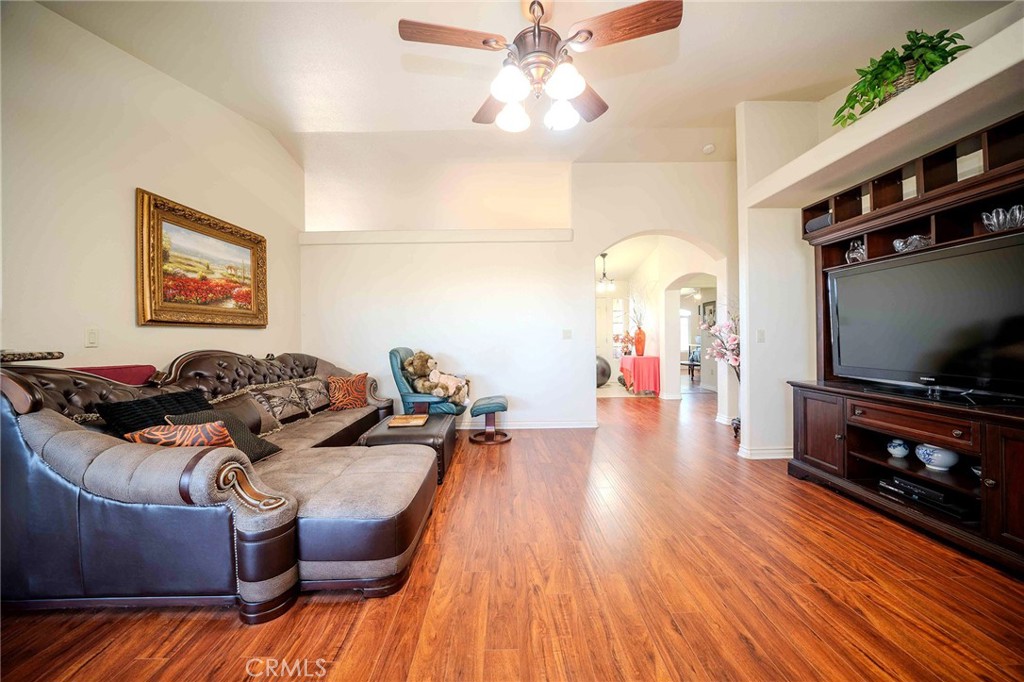 11522 Ponderosa Road Pinon Hills, CA 92372 - Photo 16 of 46 a living room with furniture and a flat screen tv