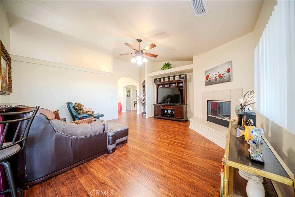 11522 Ponderosa Road Pinon Hills, CA 92372 - Photo 17 of 46 a living room with fireplace furniture and a flat screen tv