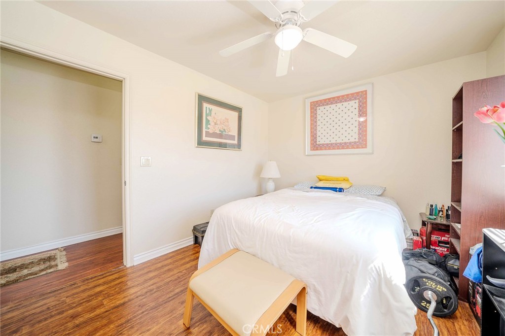 11522 Ponderosa Road Pinon Hills, CA 92372 - Photo 28 of 46 a bedroom with a bed and a chandelier