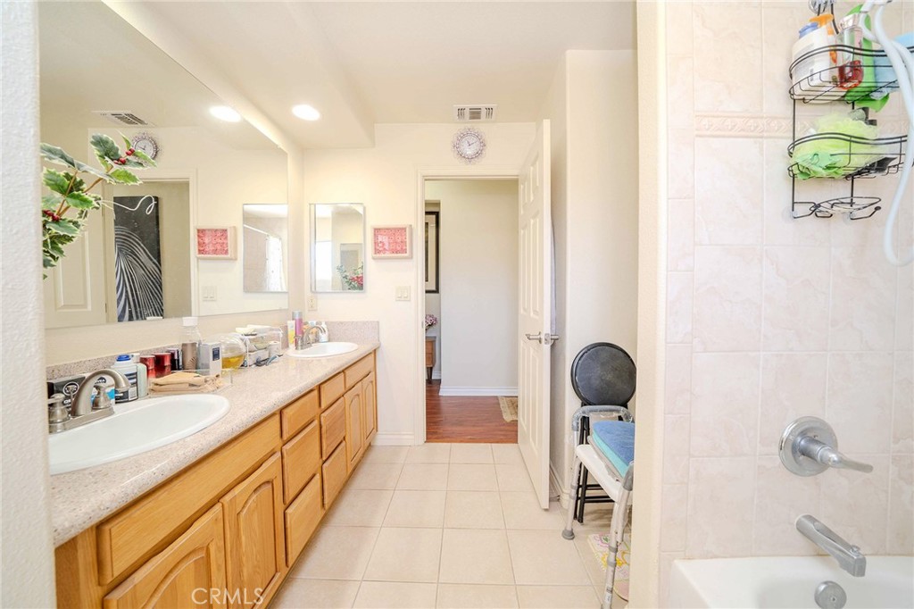 11522 Ponderosa Road Pinon Hills, CA 92372 - Photo 32 of 46 a bathroom with a tub sink and mirror