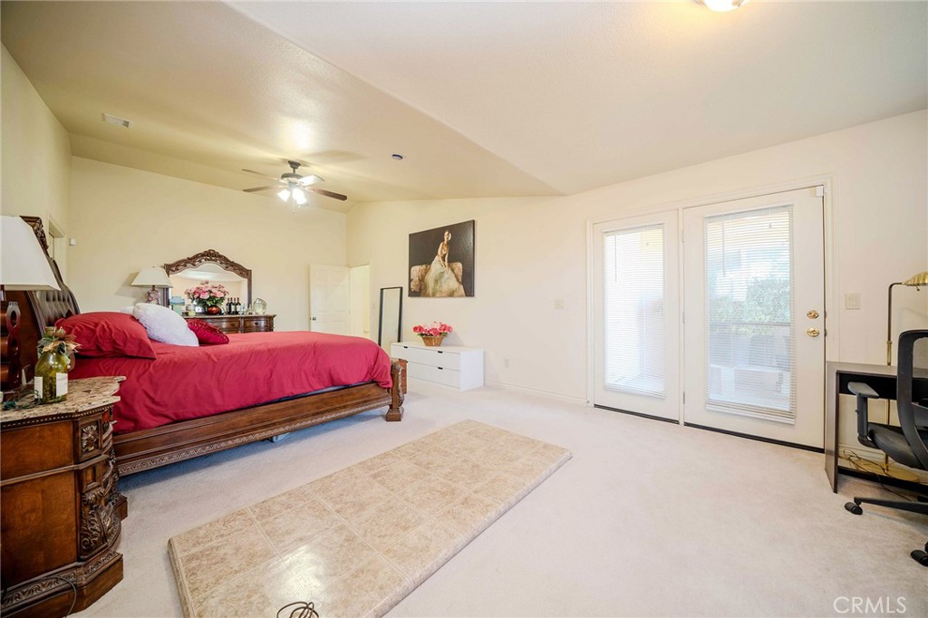 11522 Ponderosa Road Pinon Hills, CA 92372 - Photo 40 of 46 a bedroom with a bed furniture and a flat tv screen