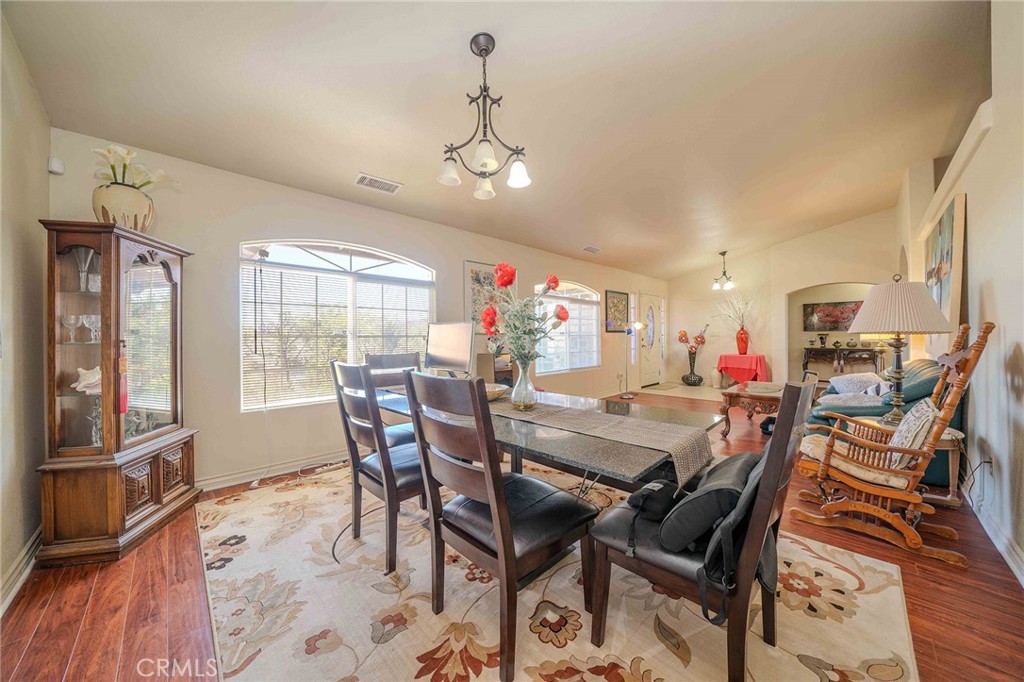 11522 Ponderosa Road Pinon Hills, CA 92372 - Photo 10 of 46 a view of a dining room with furniture window and wooden floor