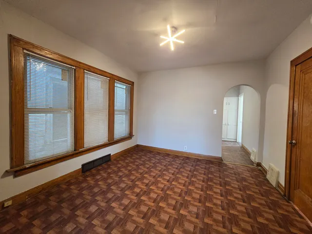a view of an empty room with a window