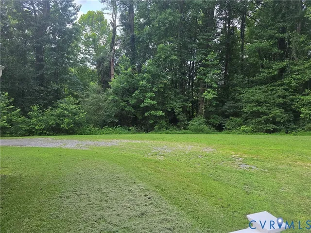a view of a field with a trees