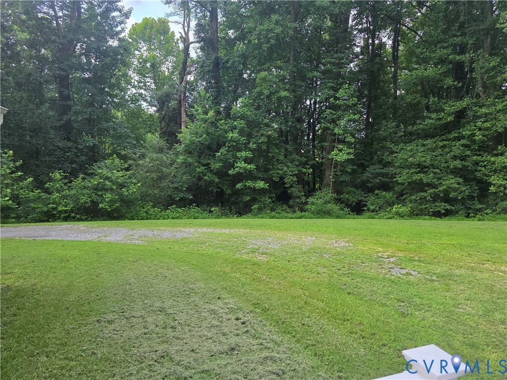 416 Berry Hill Road Tappahannock, VA 22560 - Photo 12 of 18 a view of a field with a trees