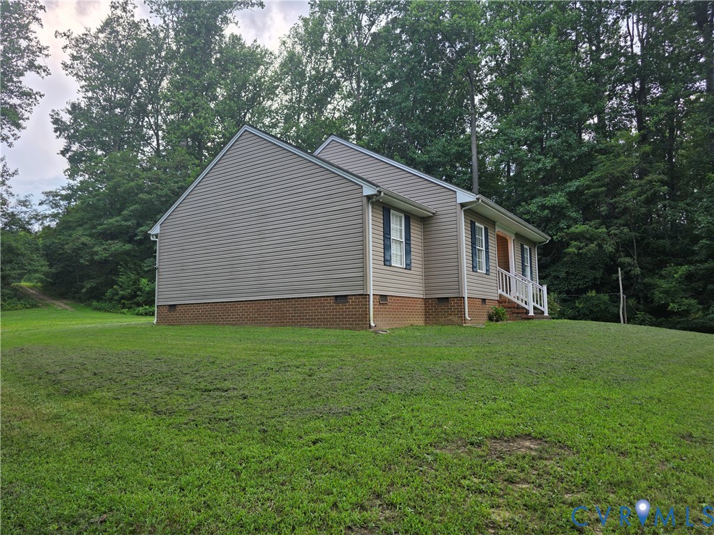 416 Berry Hill Road Tappahannock, VA 22560 - Photo 2 of 18 a backyard of a house with lots of green space