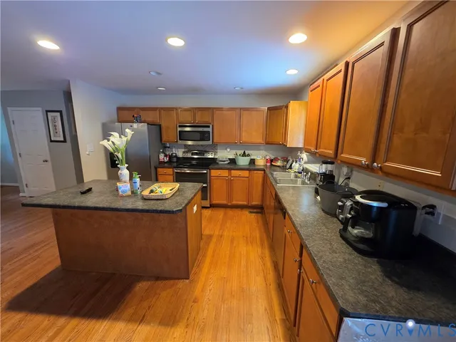 a kitchen with sink a counter top space and appliances