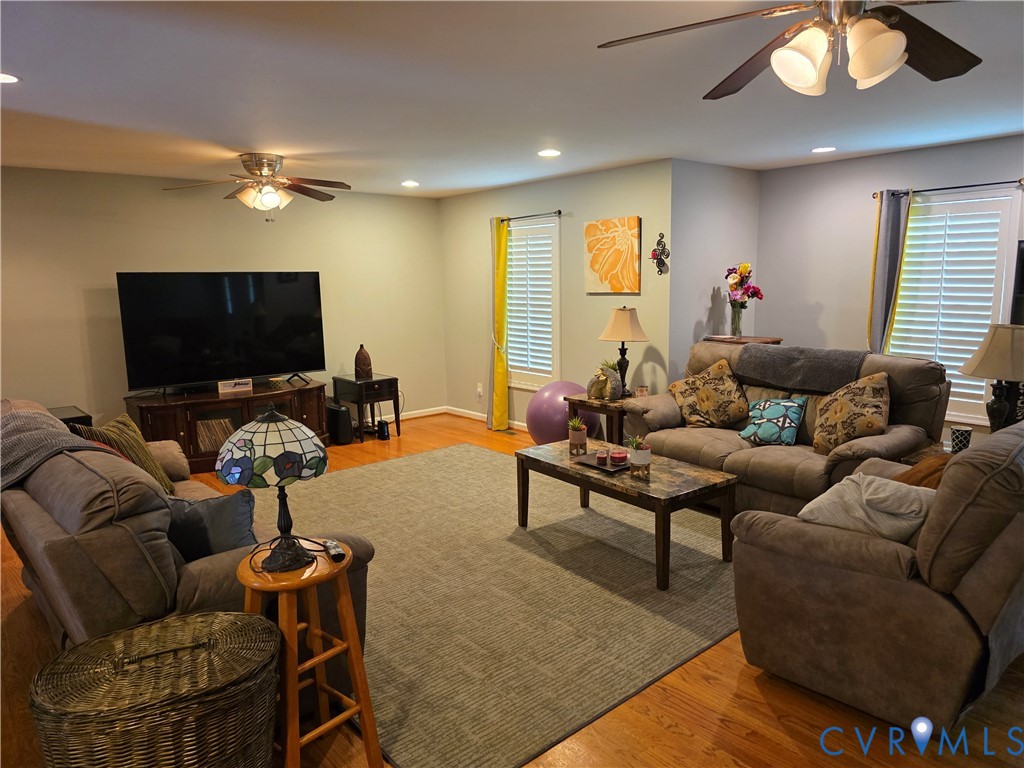 416 Berry Hill Road Tappahannock, VA 22560 - Photo 5 of 18 a living room with furniture and a flat screen tv