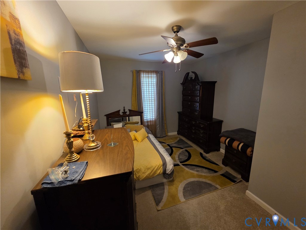 416 Berry Hill Road Tappahannock, VA 22560 - Photo 9 of 18 a view of a workspace with furniture and lamp