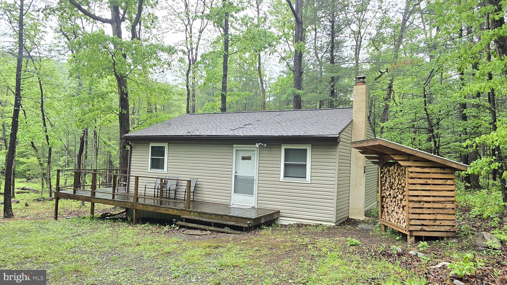 8245 Aughwick Road Fort Loudon, PA 17224 - Photo 1 of 26 a backyard of a house with barbeque oven