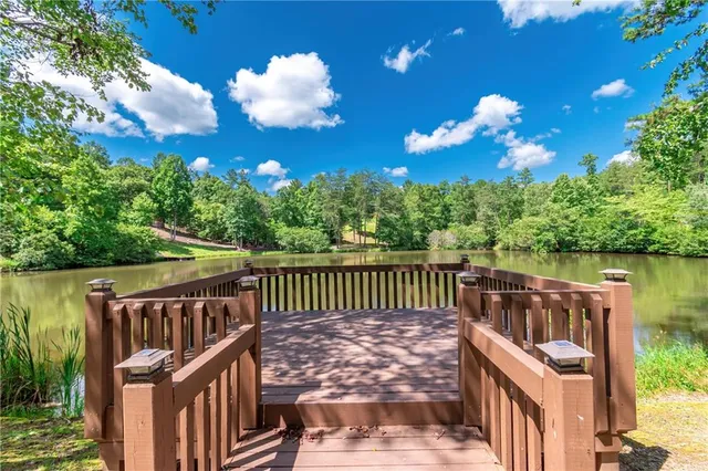 a view of a lake with a swimming pool