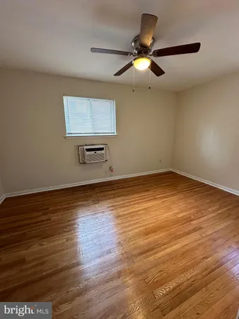 a view of room with wooden floor
