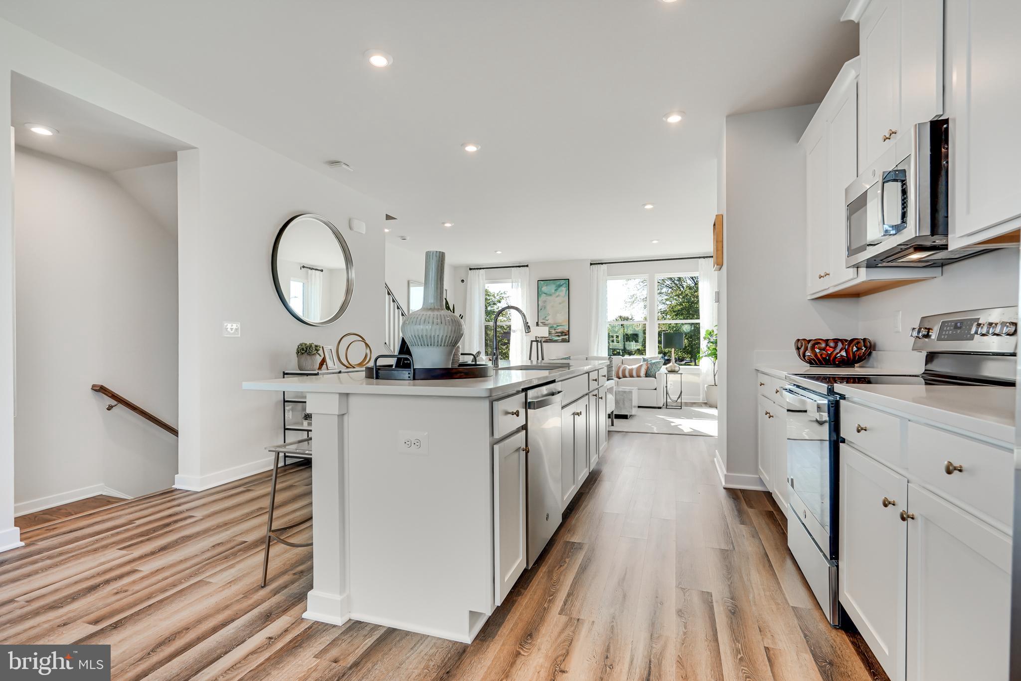 13670 Cobble Loop Woodbridge, VA 22193 - Photo 21 of 54 a kitchen with sink cabinets and refrigerator