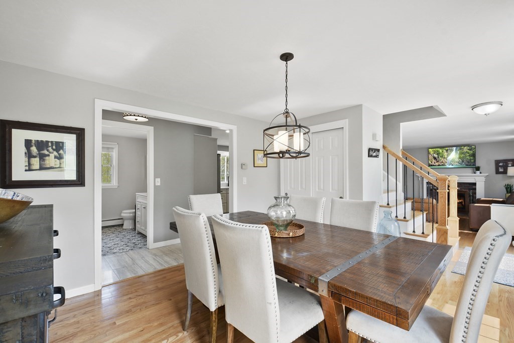 94 Hanson Road Charlton, MA 01507 - Photo 12 of 42 a view of a dining room with furniture wooden floor and chandelier