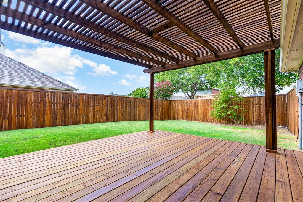 a view of outdoor space with wooden deck
