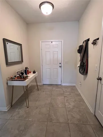 a view of a room with a table and a chair