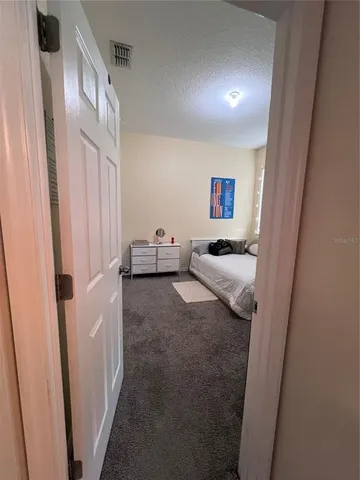 a living room with furniture and a shower