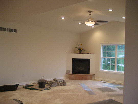 2573 Rogene Drive Oregon, IL 61061 - Photo 5 of 9 a view of an empty room with a fireplace and fan
