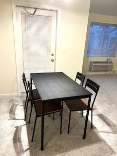 a view of table and chair in wooden floor