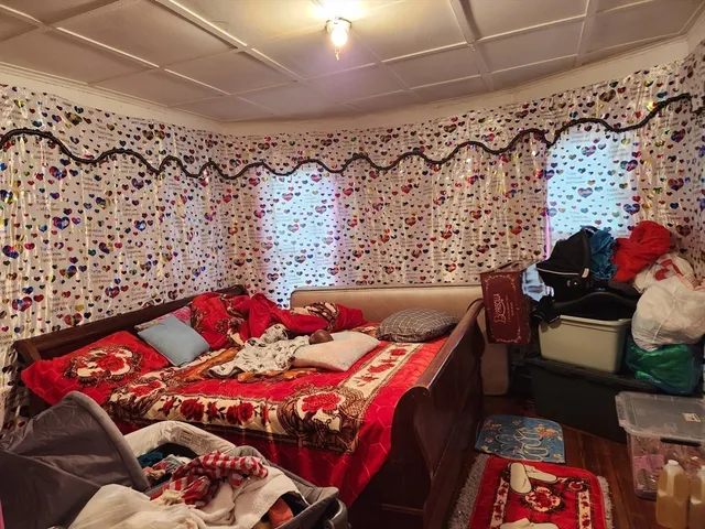 a bedroom with a bed and a couch