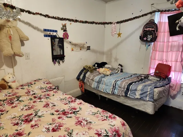 a bedroom with a bed and a walk in closet